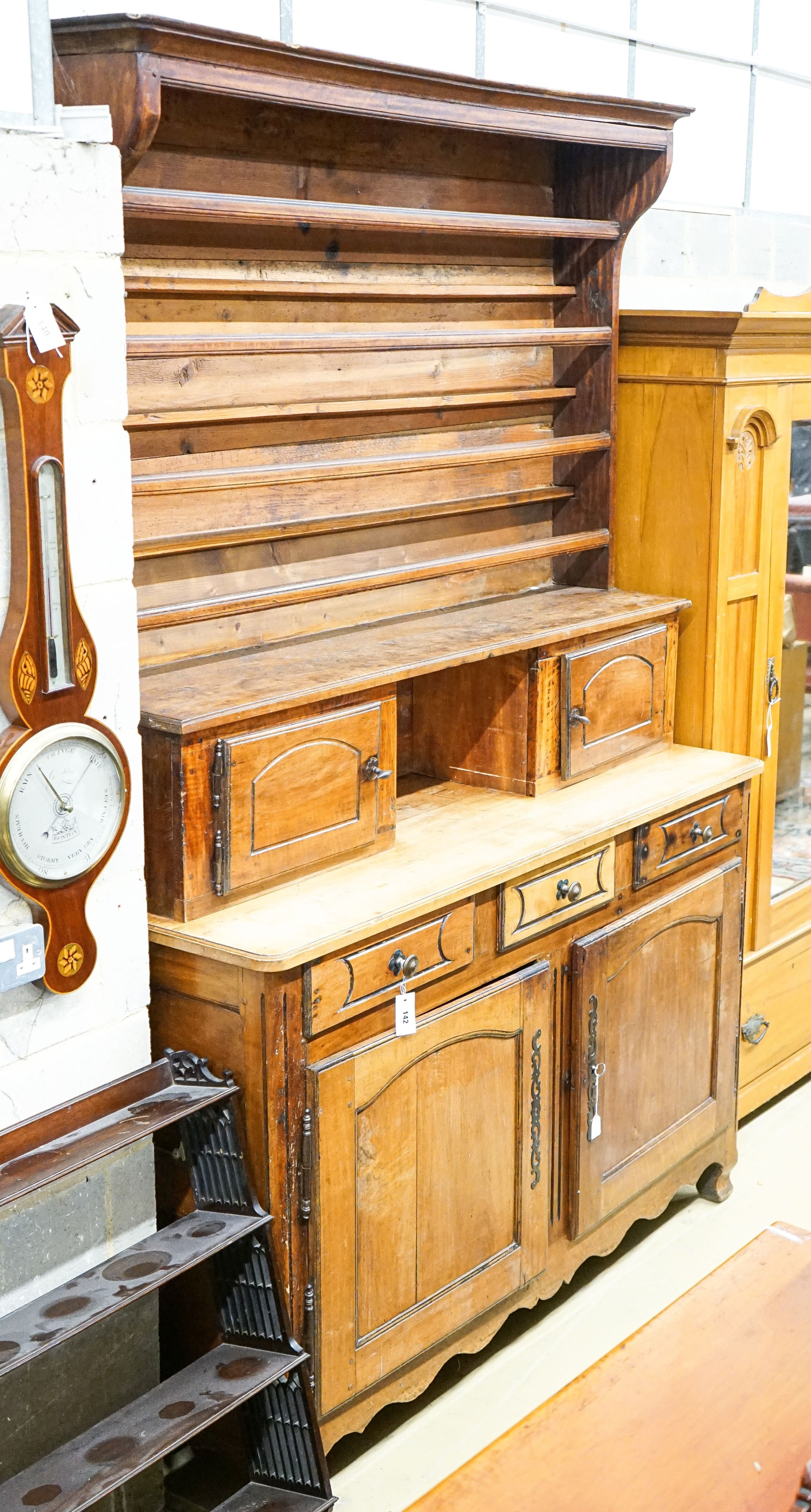 A late 18th / early 19th century French fruitwood dresser, length 160cm, depth 57cm, height 240cm